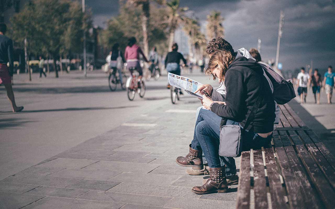 Tourists looking at the map at Barcelona Promenade.