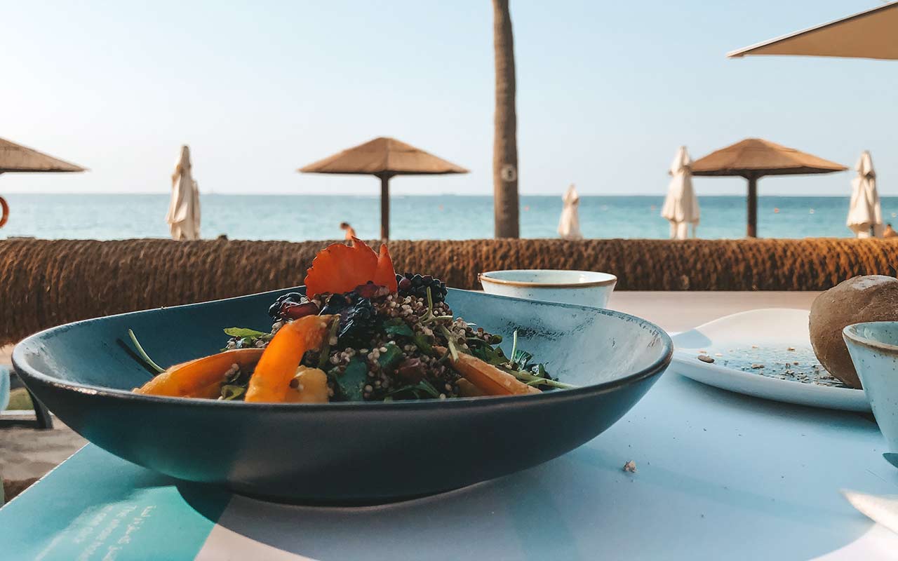 Enjoy a delicious dish under the sun with a view of the beach at any hotel at the Jumeirah district