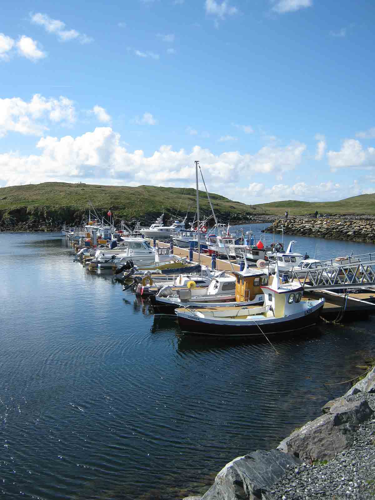 Yachts docked in Shetland Islands, UK over a sunny a day