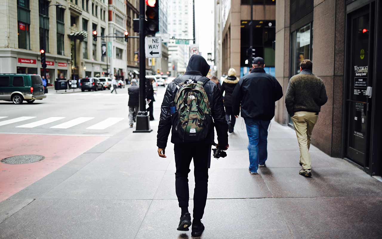  A tourist walks with his belongings at all times as he walks around Chicago streets 