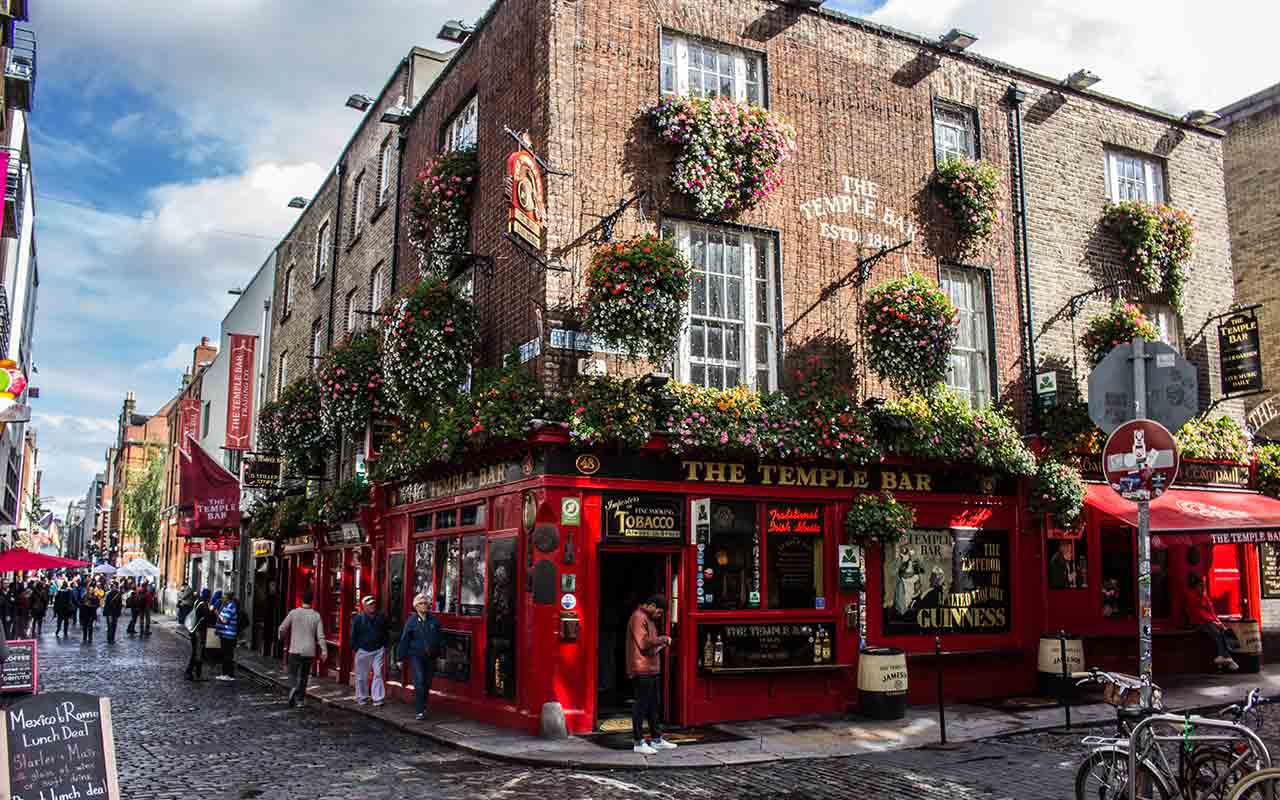 Tourists and locals in Temple Bar Street Ireland at night