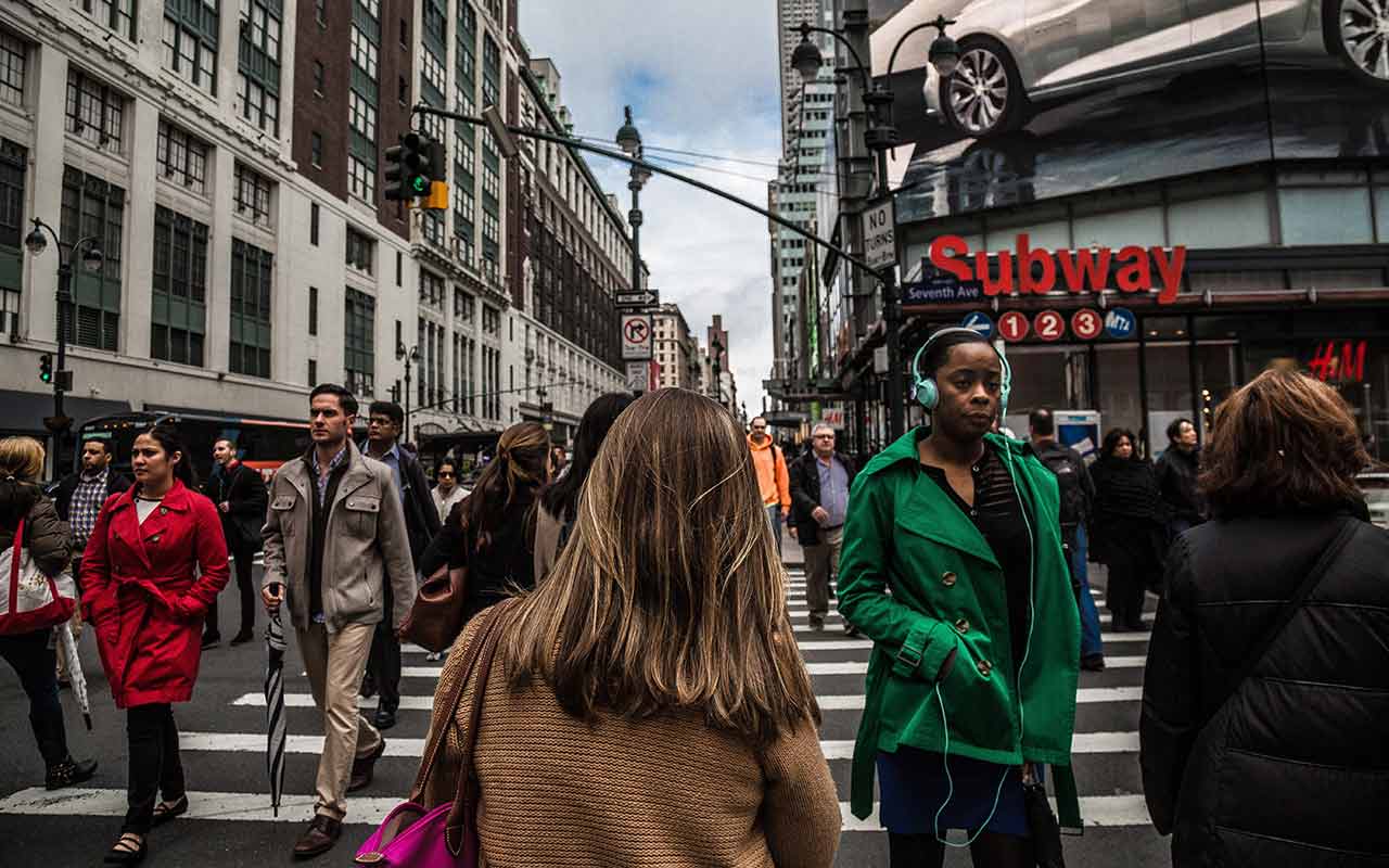 New Yorkers and tourists going about their lives in New York