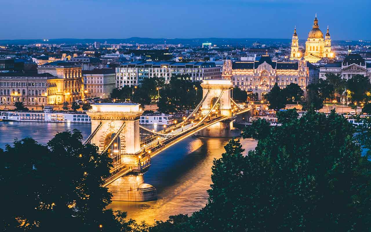 Welcome to Budapest! The night view of Széchenyi Chain Bridge across Danube river