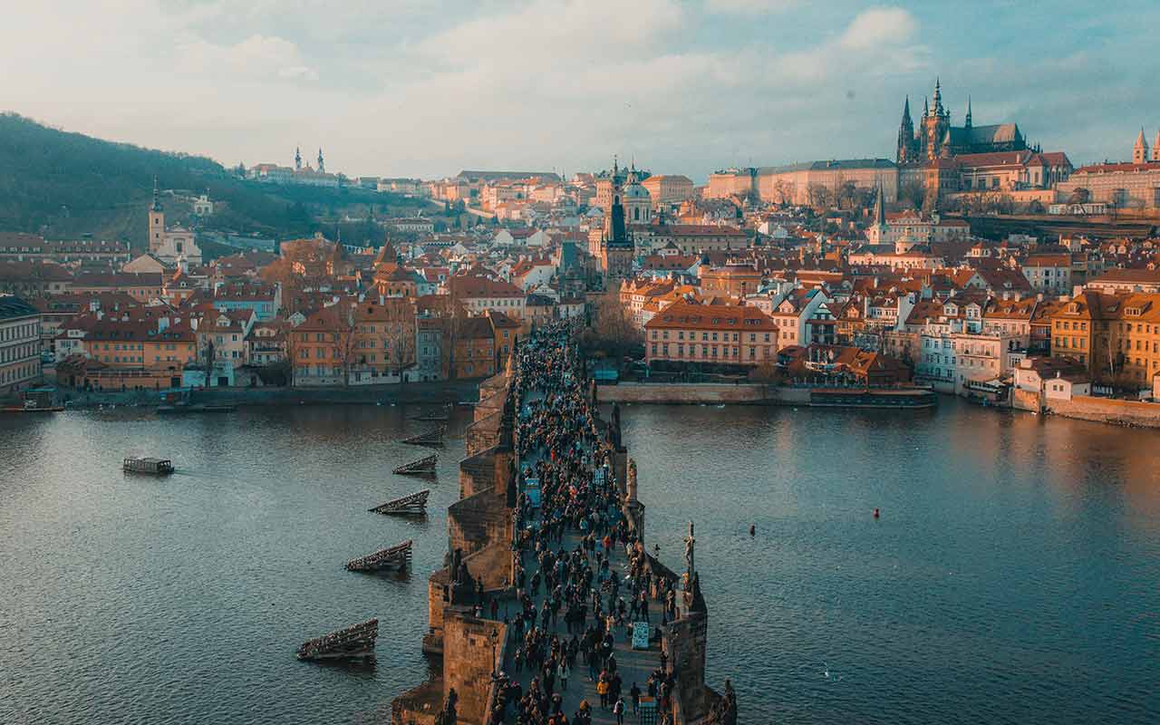 Tourists crowding the Charles Bridge in Prague