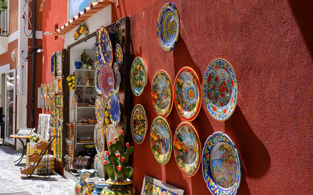 Colorful ceramic plates sold in a shop at Positano
