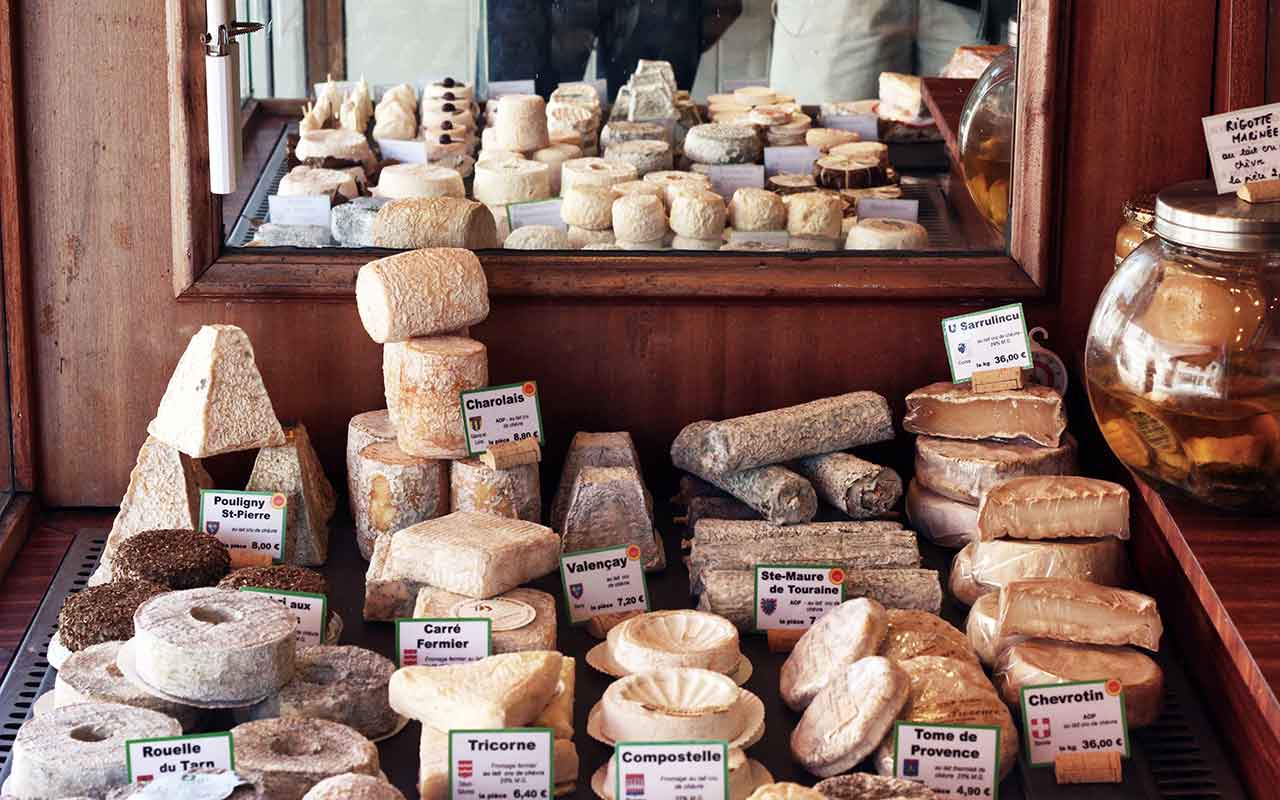 Various types of cheese at a shop in France