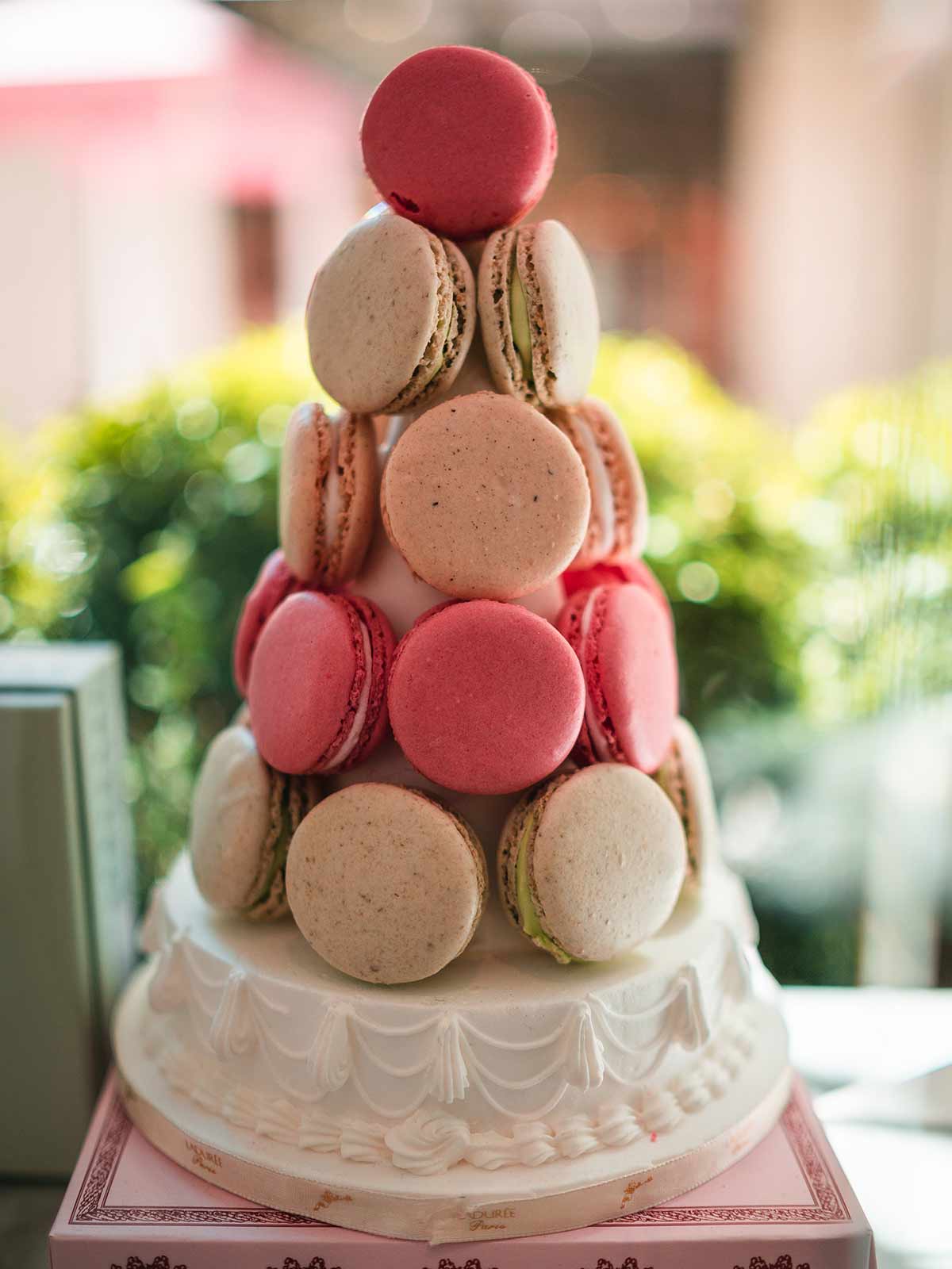 French macaron-topped cake in Ladurée, Cannes, France