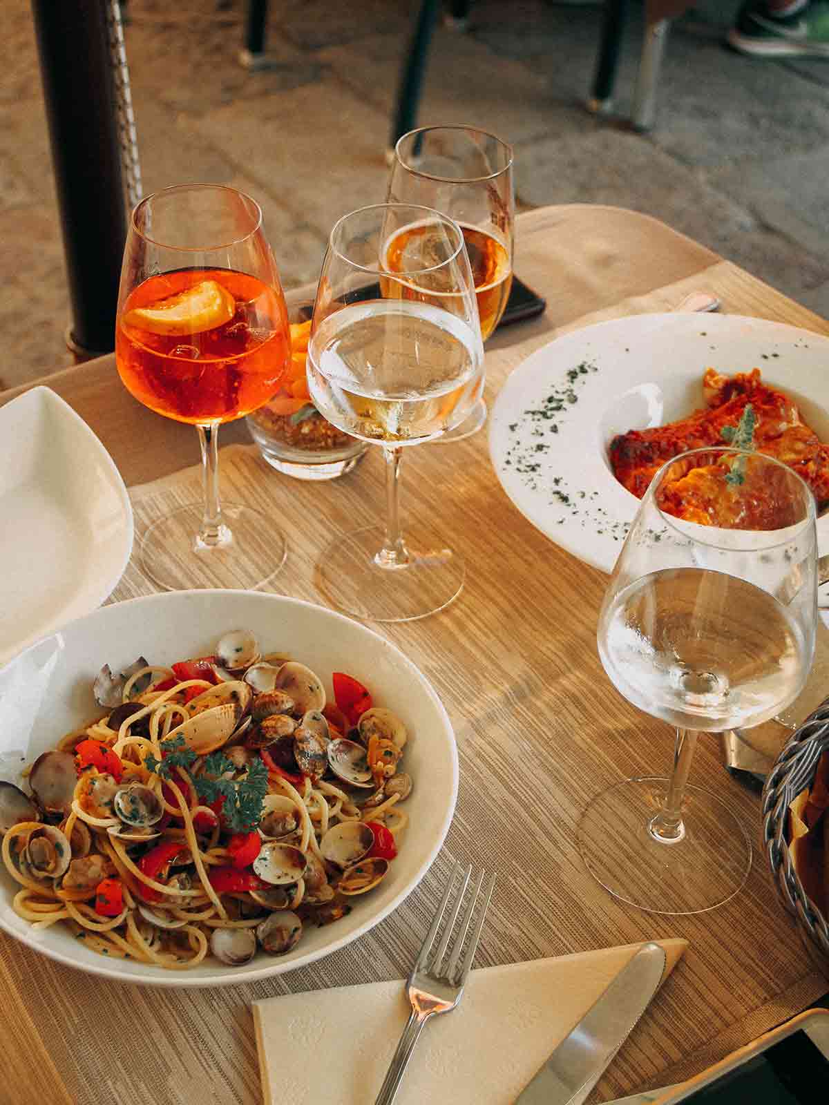 Italian Pasta served with wine in a restaurant at Venice, Italy