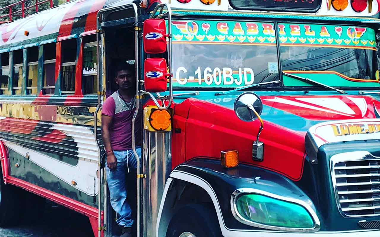 A colorful repurposed school bus used as a local mode of transport in Guatemala