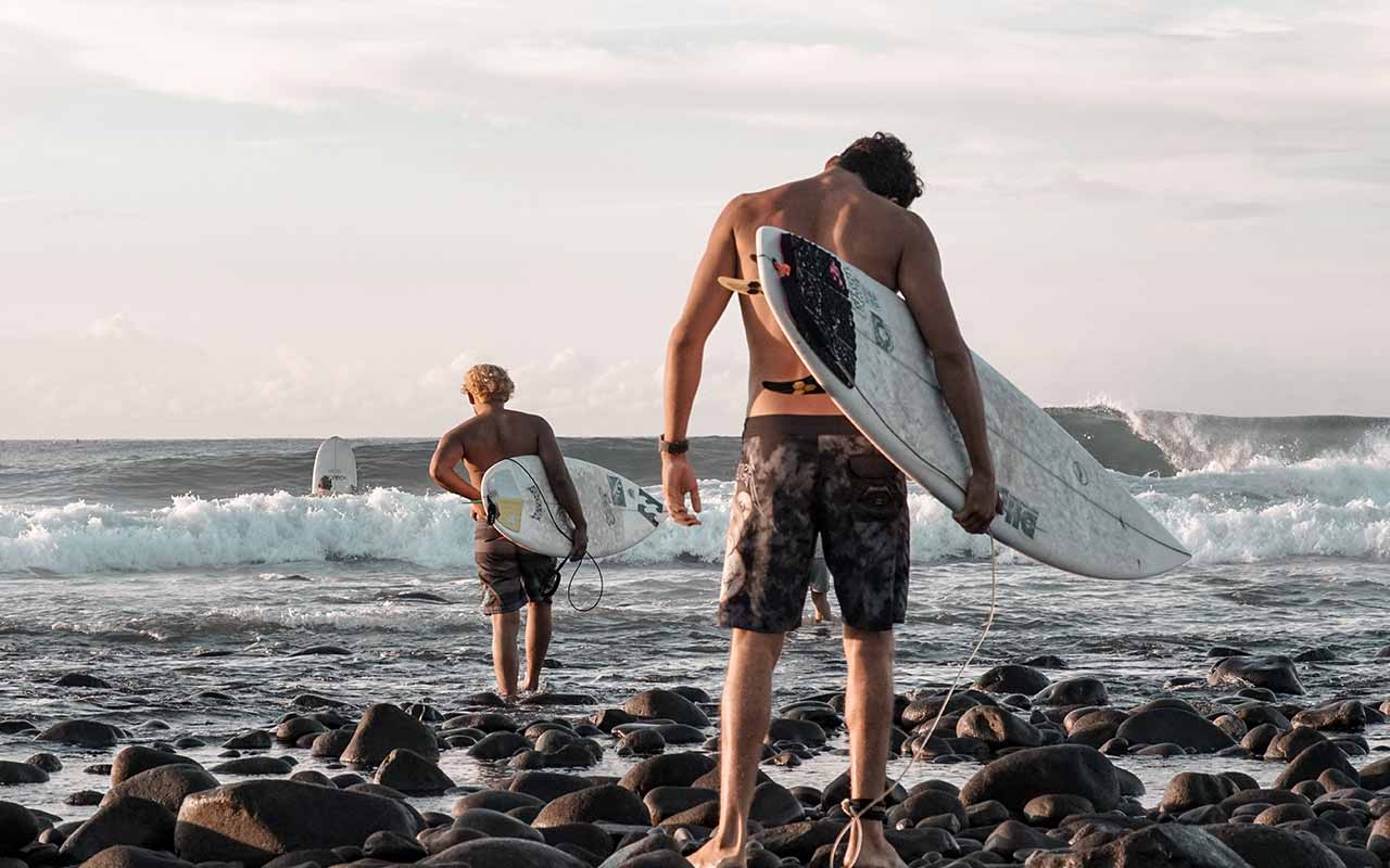 Surfers at El Tunco beach